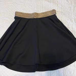 Black skirt with gold detailed belt